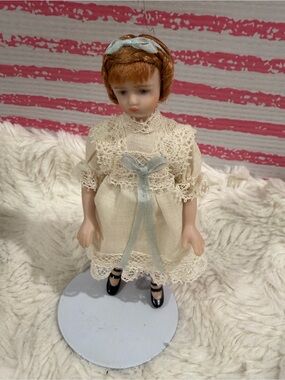 Vintage Cream Porcelain Doll with Light Blue Ribbon Accent  Joan O Grady